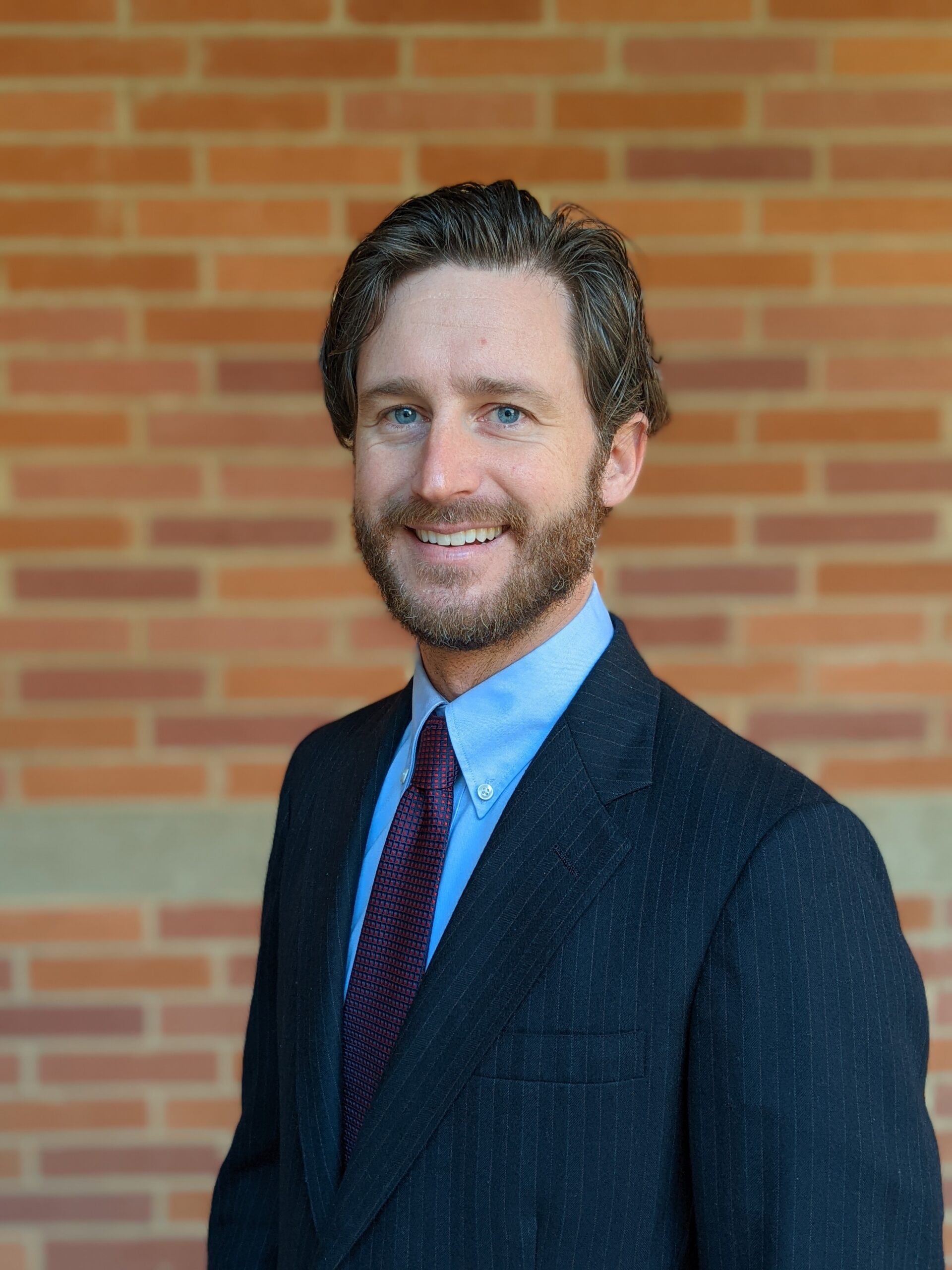 This is a picture of Stephen Peterson, somatic business coach, in formal business attire. Its purpose is to show the reader what Stephen Peterson looks like in a professional setting.