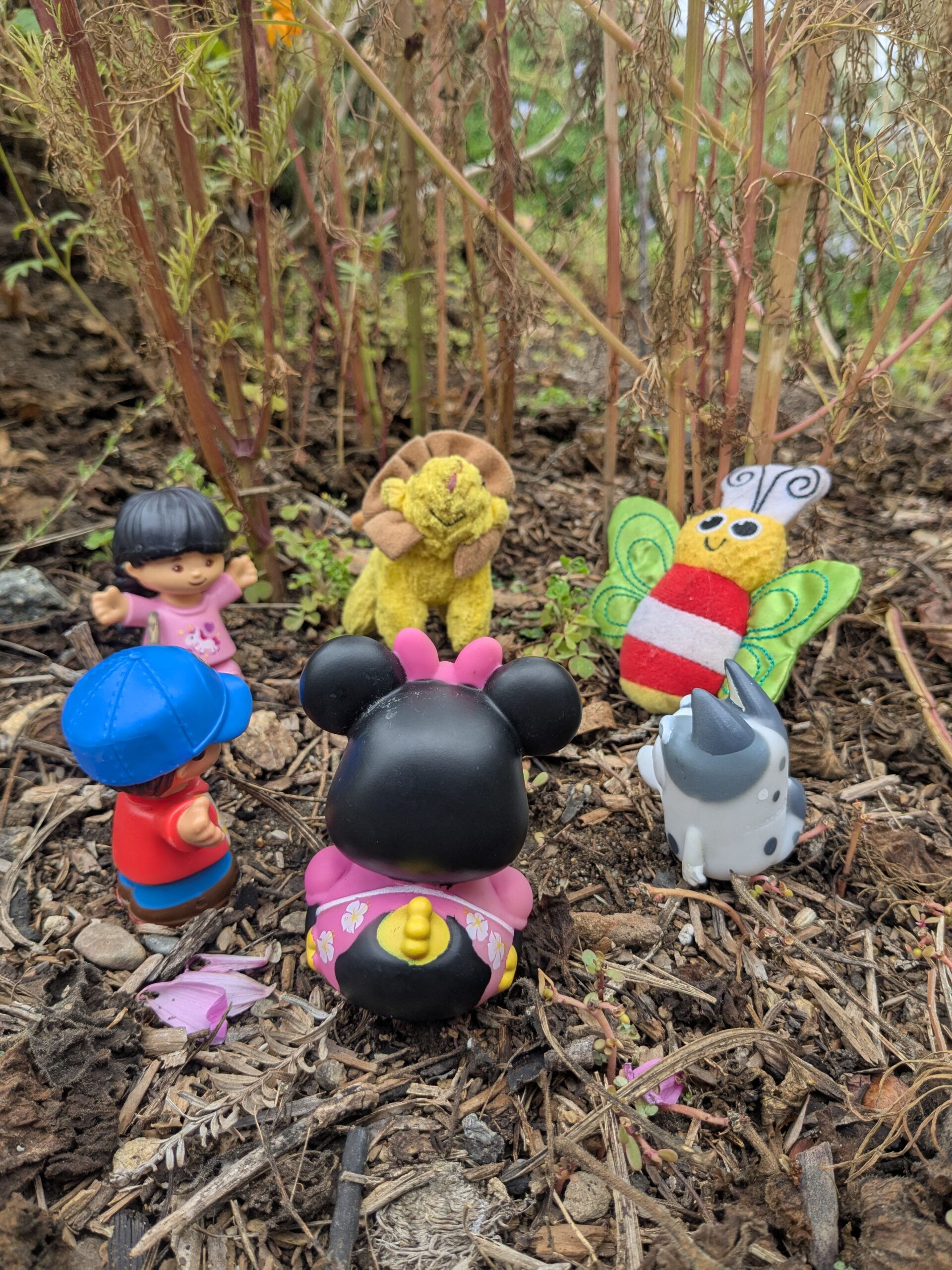 A humorous original photo of six figures practicing together in a circle to represent an image of a group coaching session.